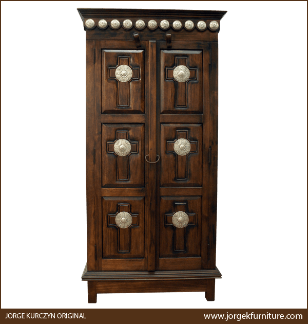 Front view of Santa Fe armoire with carved crosses and copper conchos