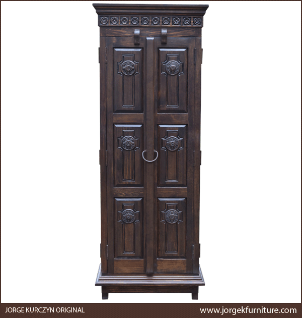 Front view of Santa Fe 2 armoire with carved crosses and dark conchos