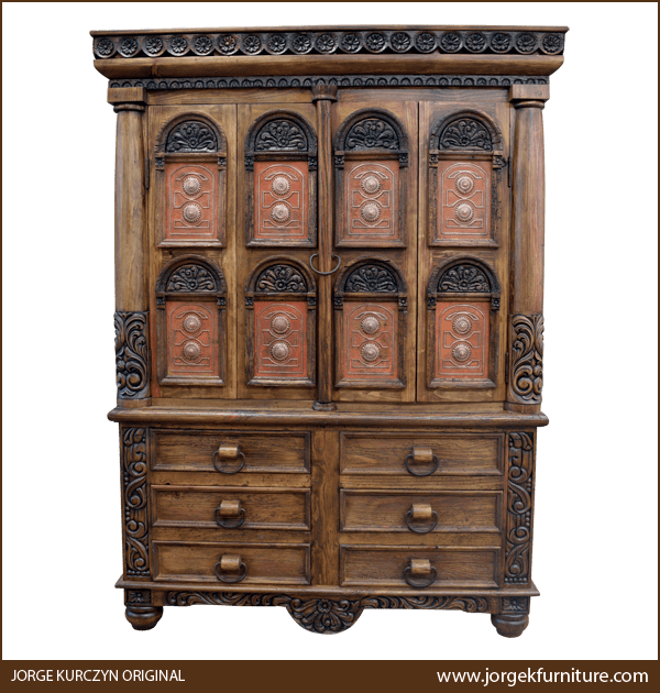 Front view of Irma armoire with hammered copper panels and carved floral scroll details