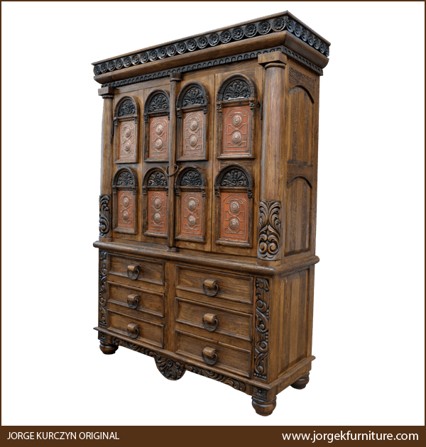 Three-quarter angle of Irma armoire showing copper panels and hand carved uprights