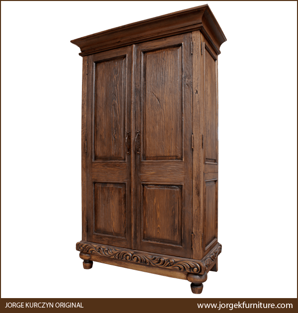 Three-quarter angle of Classic Spanish Colonial Armoire showing carved base and iron handles
