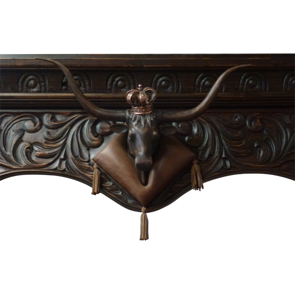 Detail of carved longhorn head with copper crown and leather collar