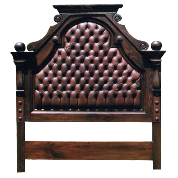 Front view of Western-style headboard with red tufted leather and iron conchos