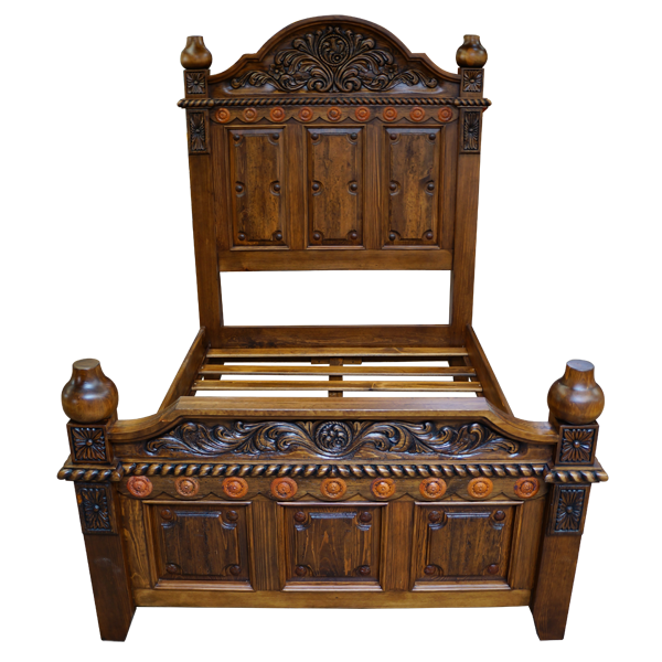 Elevated front view of Spanish colonial bed with crest carving and copper conchos