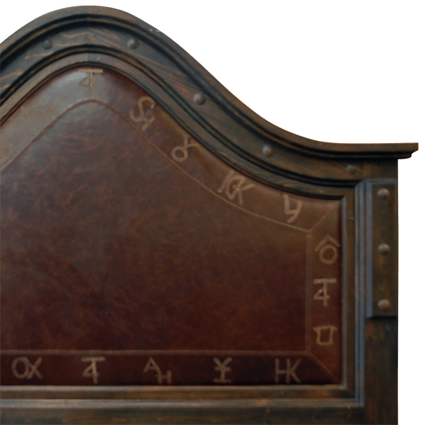 Detail of headboard with ranch brand leather and forged iron nails