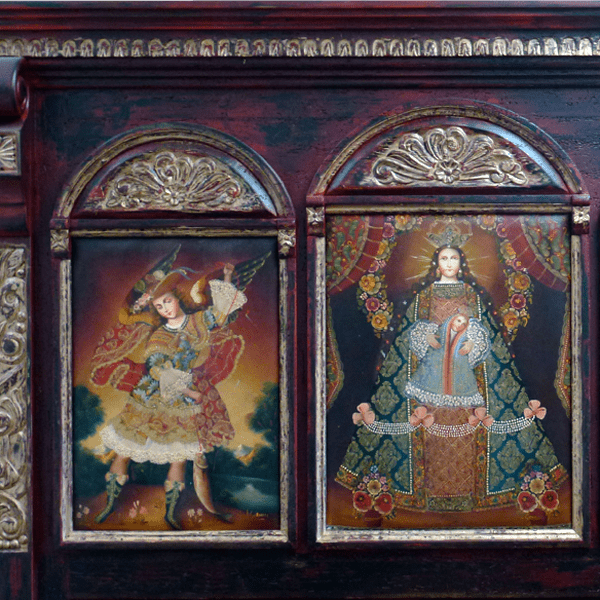 Detail of headboard with religious oil paintings and gold scroll carving