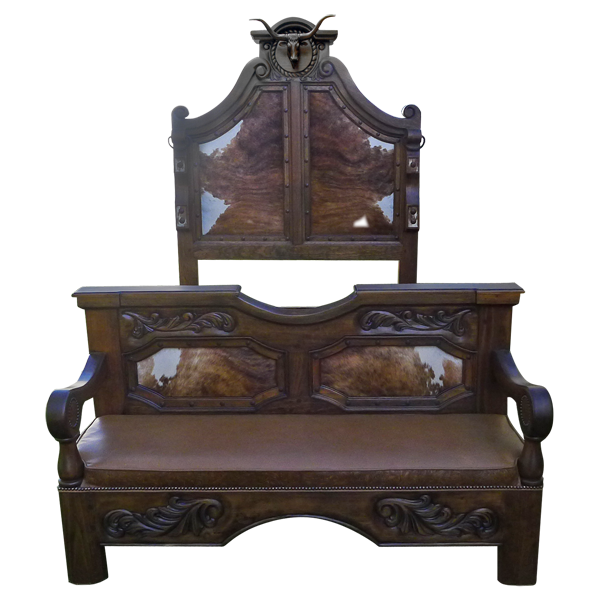 Front view of Western-style bed with bull crest, cowhide bench, and scroll carving
