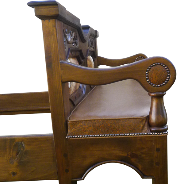 Side detail of footboard bench with scroll armrest, cowhide panels, and gilt nails