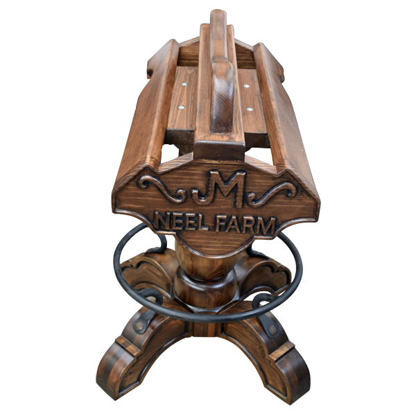 Elevated front view of Champion 3 Saddle bar stool with copper tooling and wood carving