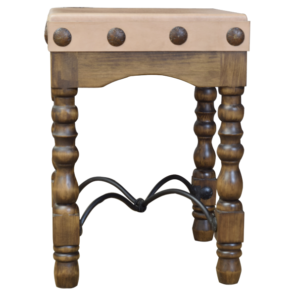 Front view of Spanish colonial bar stool with cowhide seat and iron conchos