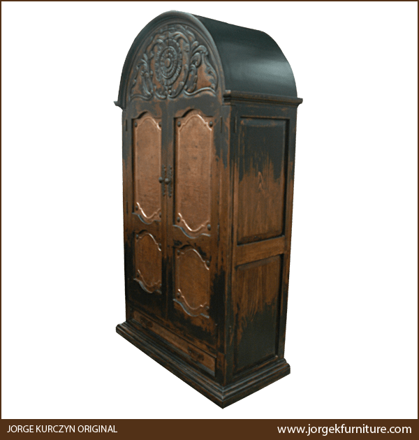 Three-quarter view of Spanish colonial armoire highlighting antique stained finish, darker edges and lighter center